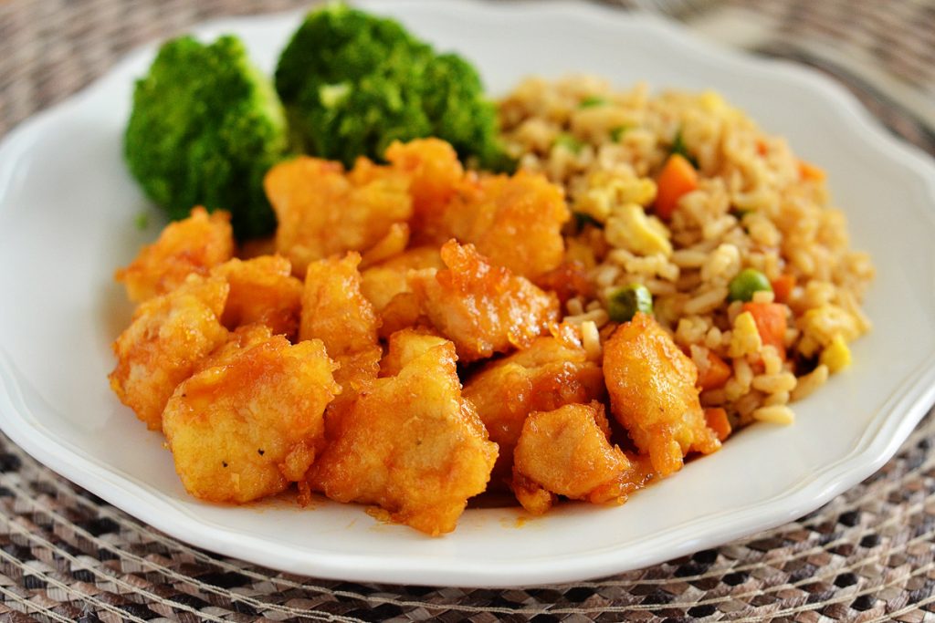 Delicious sweet and sour chicken that is baked in the oven and served with a side of flavorful fried rice. Life-in-the-Lofthouse.com