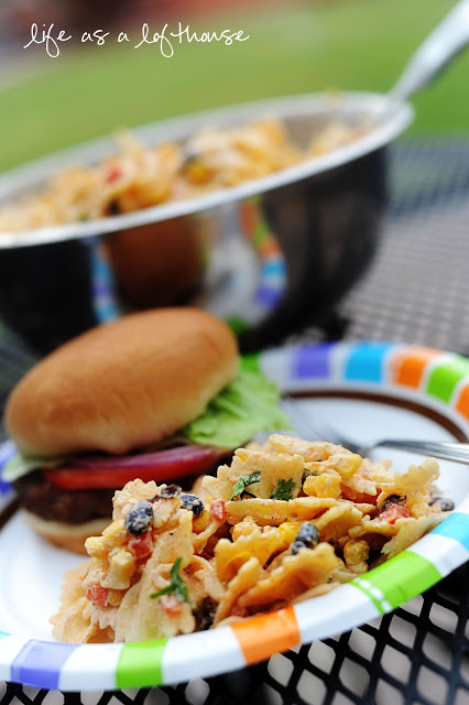Fiesta Chicken Pasta Salad is full of tender pasta and chicken that is mixed with taco seasoning, ranch dressing, corn and black beans. Life-in-the-Lofthouse.com