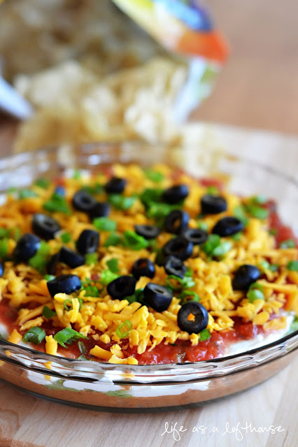 Seven Layer Dip with beans, cheese, sour cream and more!