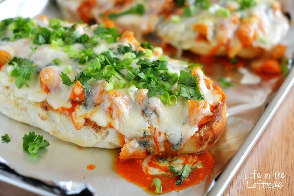 Buffalo Chicken French Bread Pizza is loaded with grilled chicken, garlic, ranch dressing and buffalo wing sauce and topped off with mounds of gooey cheese. Life-in-the-Lofthouse.com