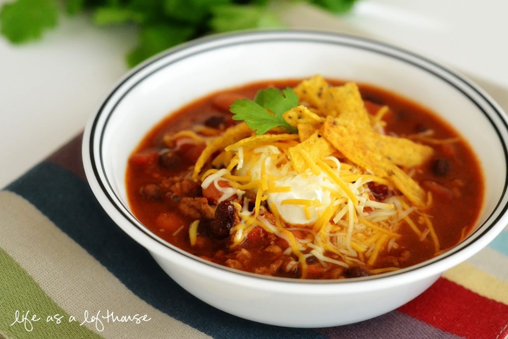 Taco Ranch Chili is chili slow cooked in the Crock Pot and full of ranch and taco flavor. Life-in-the-Lofthouse.com