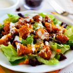 This delicious salad is full of crunchy romaine lettuce, dried cranberries, shredded carrots, cheese, and of course those amazing sticky chicken fingers. Life-in-the-Lofthouse.com