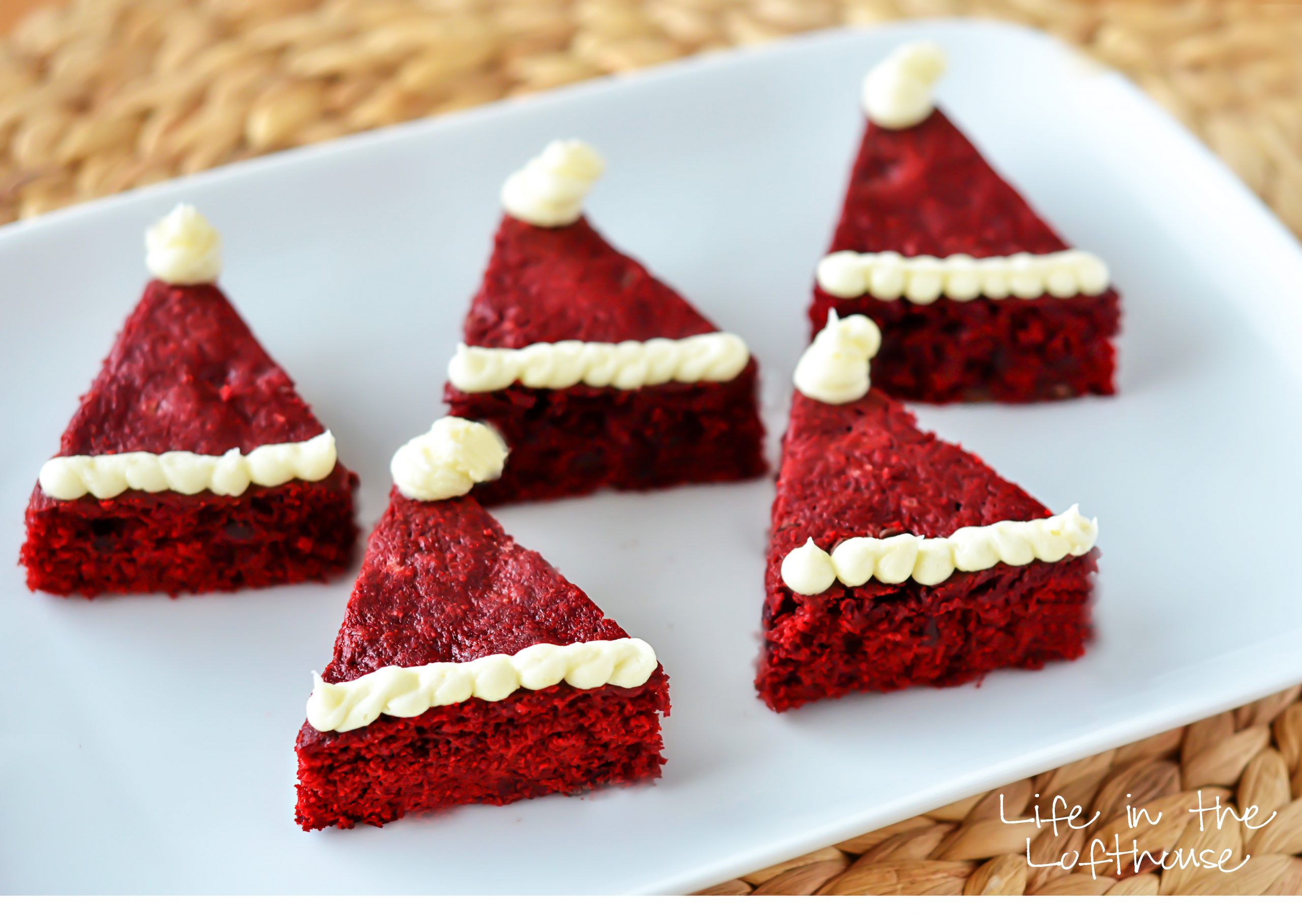 Red Velvet Brownies shaped as Santa Clause hats. 