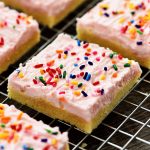 Soft, frosted and perfectly delicious Sugar Cookie Bars! These amazing cookie bars would be perfect for any occasion. You can change the color according to the holiday.