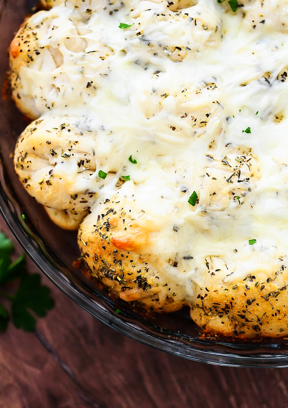 Cheesy Garlic Pull Apart Rolls are buttermilk biscuits covered in melted Mozzarella cheese, herbs and garlic butter.