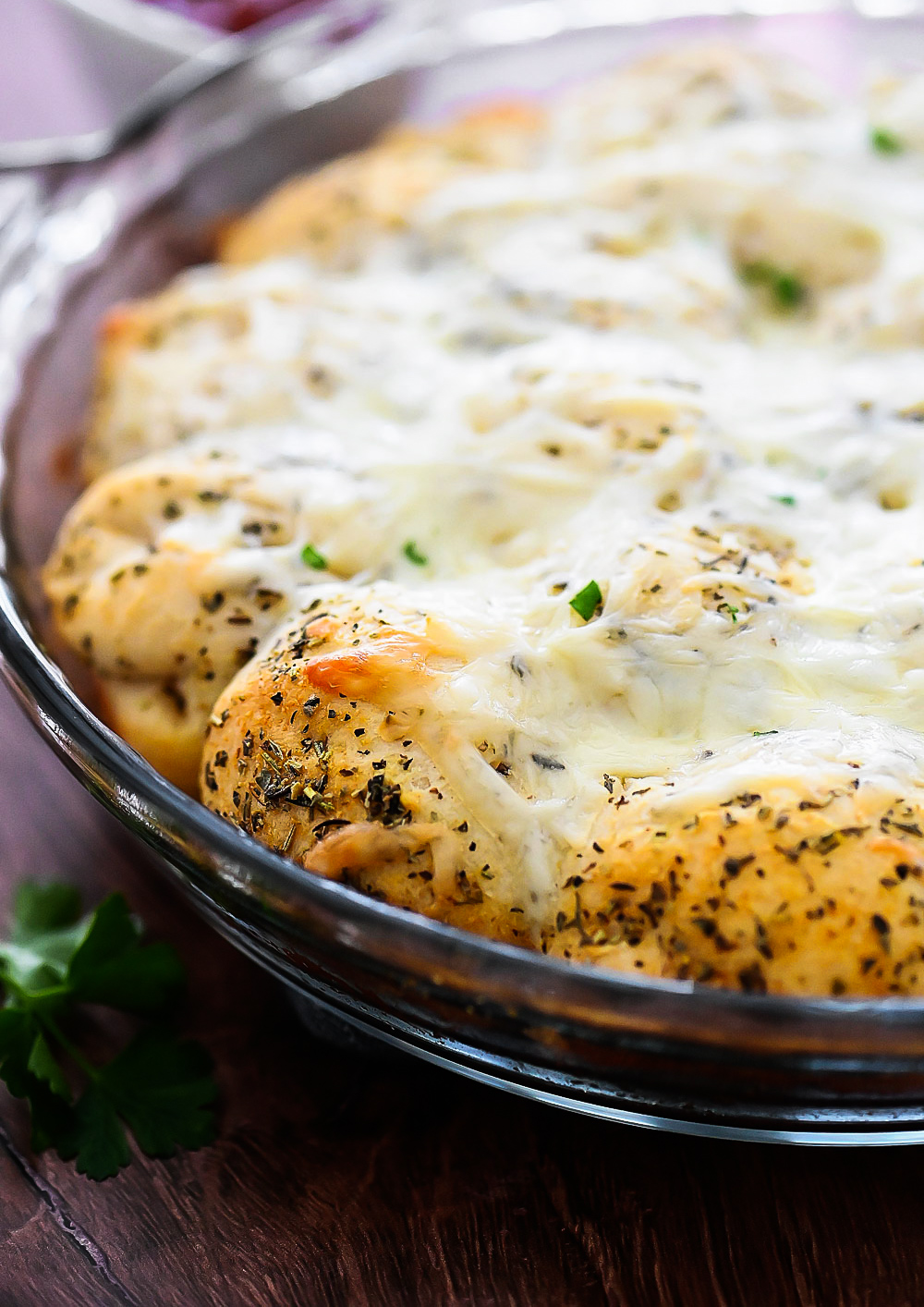 Cheesy Garlic Pull Apart Rolls are buttermilk biscuits covered in melted Mozzarella cheese, herbs and garlic butter.
