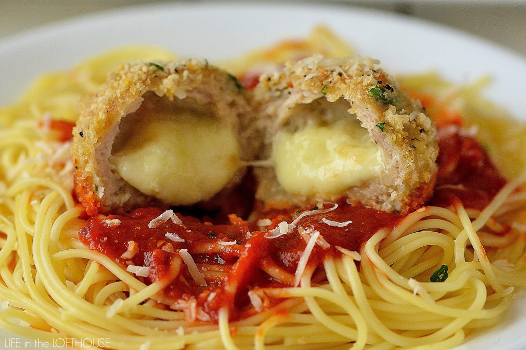 Chicken Parmesan stuffed meatballs are made of ground chicken, parmesan cheese, fresh parsley, panko bread crumbs and stuffed with mozzarella cheese. Life-in-the-Lofthouse.com