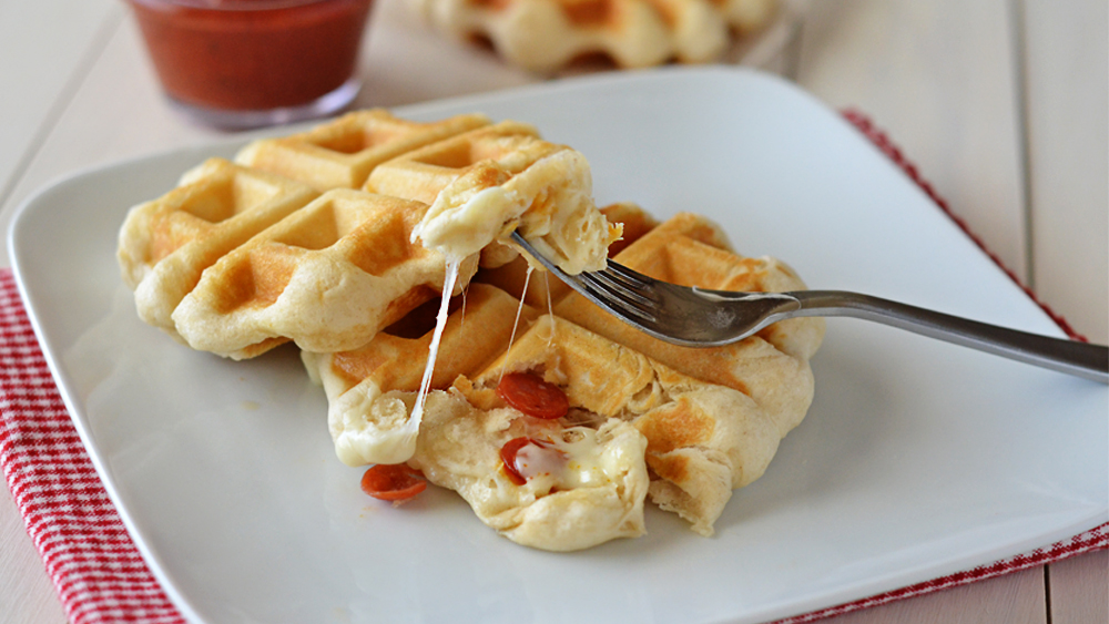 These pizza waffles are made from Pillsbury® Grands Flaky Layer biscuits and stuffed with mozzarella cheese and mini pepperonis. Life-in-the-Lofthouse.com