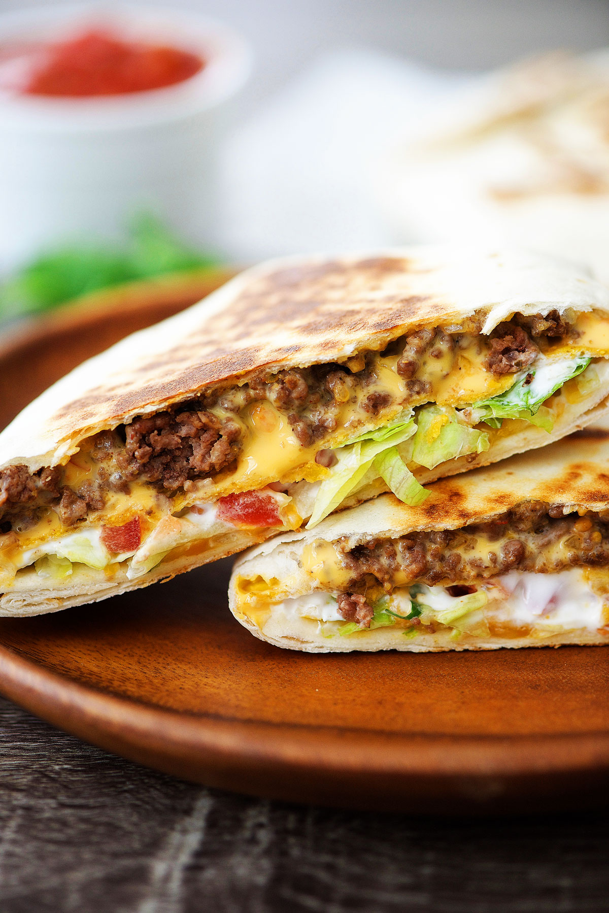 Crunchwrap Supremes are loaded with seasoned ground beef, nacho cheese, sour cream and a hidden corn tortilla all wrapped inside a large flour tortilla. Life-in-the-Lofthouse.com