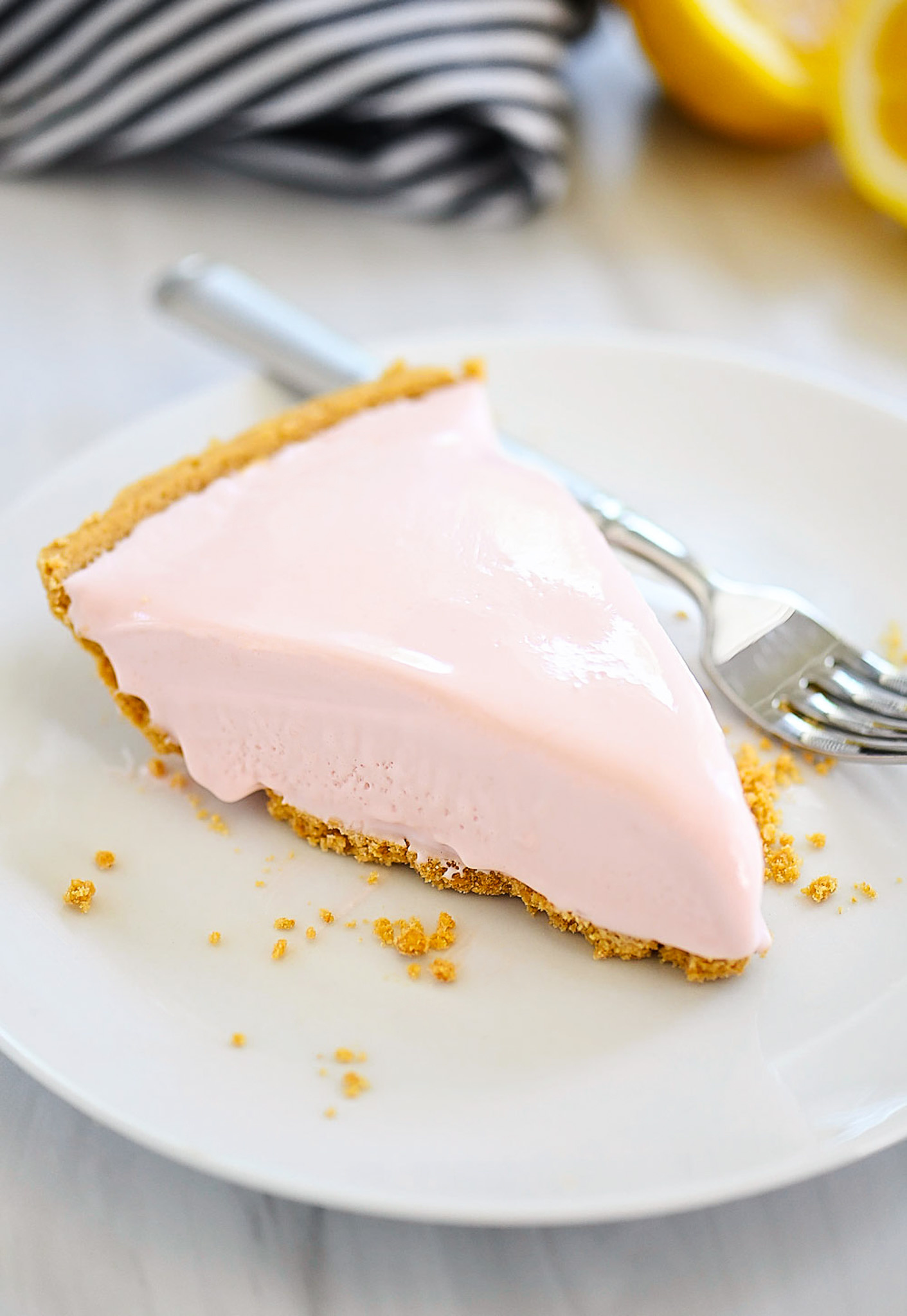 Frozen pink lemonade pie is a refreshing and creamy pie that tastes just like frozen pink lemonade and is made with only 4 ingredients. Life-in-the-Lofthouse.com