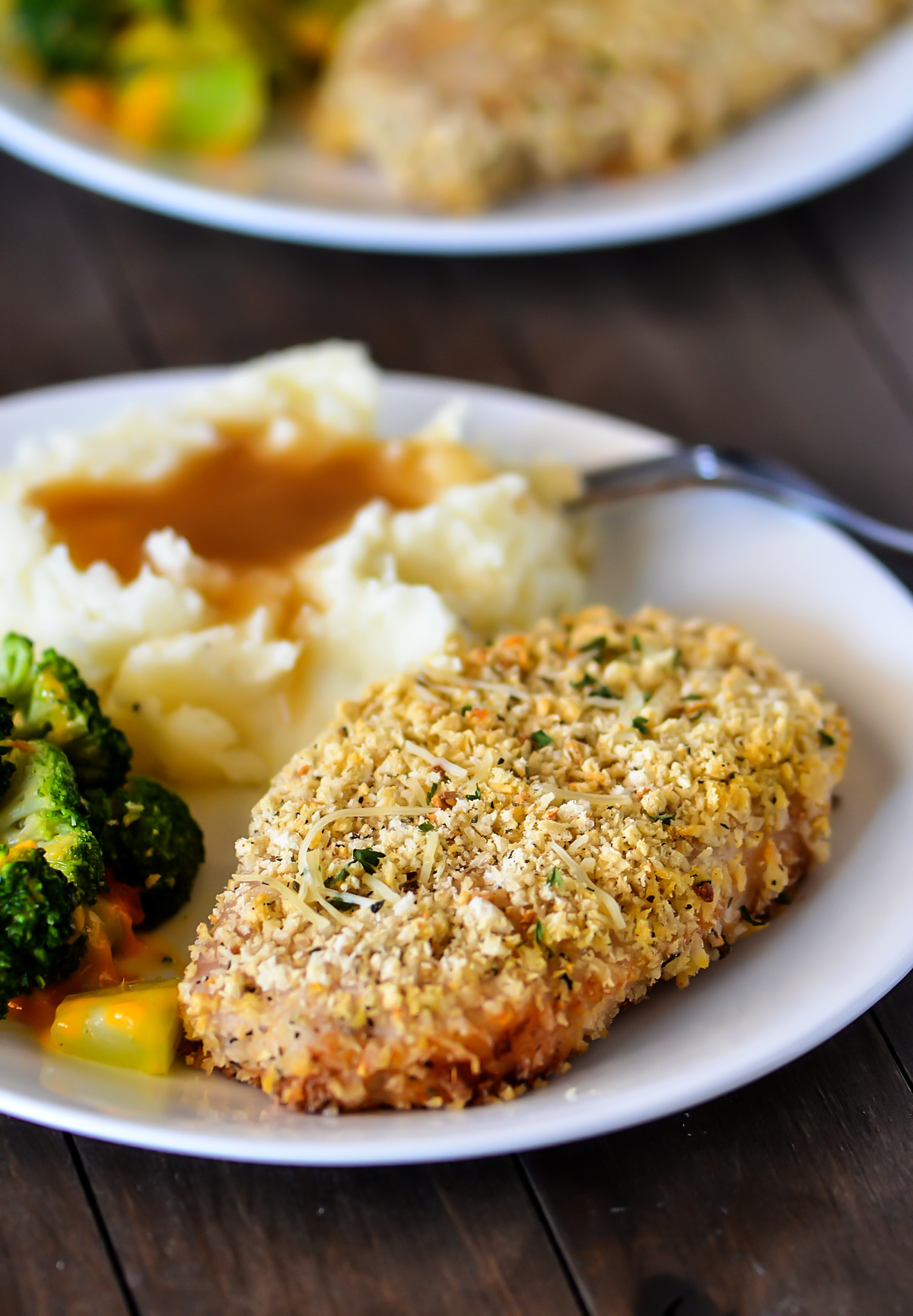 Baked Parmesan Pork Chops are tender, seasoned pork chops with a crispy outside crust. Life-in-the-Lofthouse.com