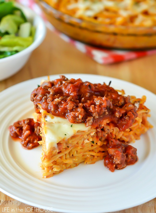 Spaghetti Pie is tossed in four cheeses and a quick and easy homemade meat sauce. Life-in-the-Lofthouse.com