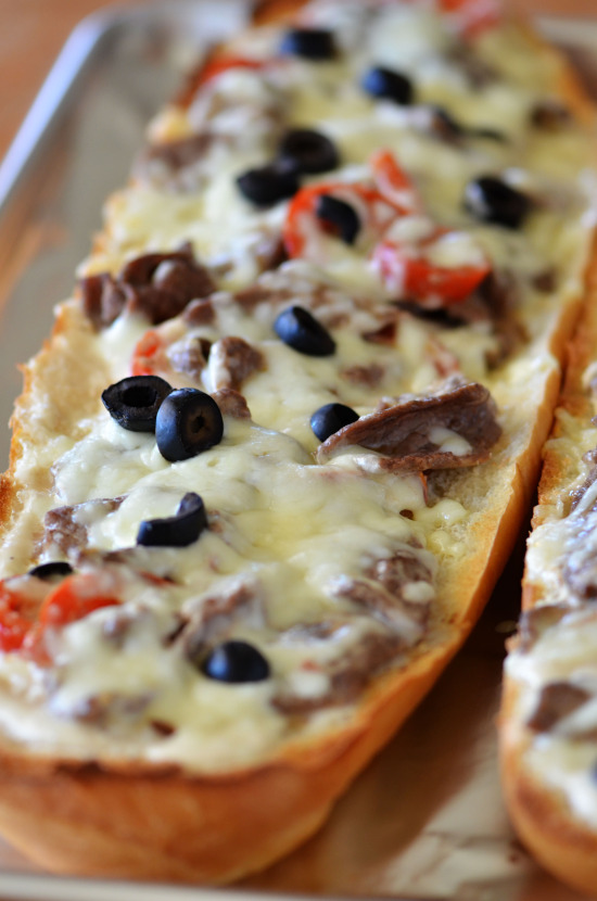 Think steak, cheese and bell peppers tossed in creamy Ragù® Cheese Creations Classic Alfredo Sauce baked on French bread make up this Italian cheese steak french bread pizza. Life-in-the-Lofthouse.com