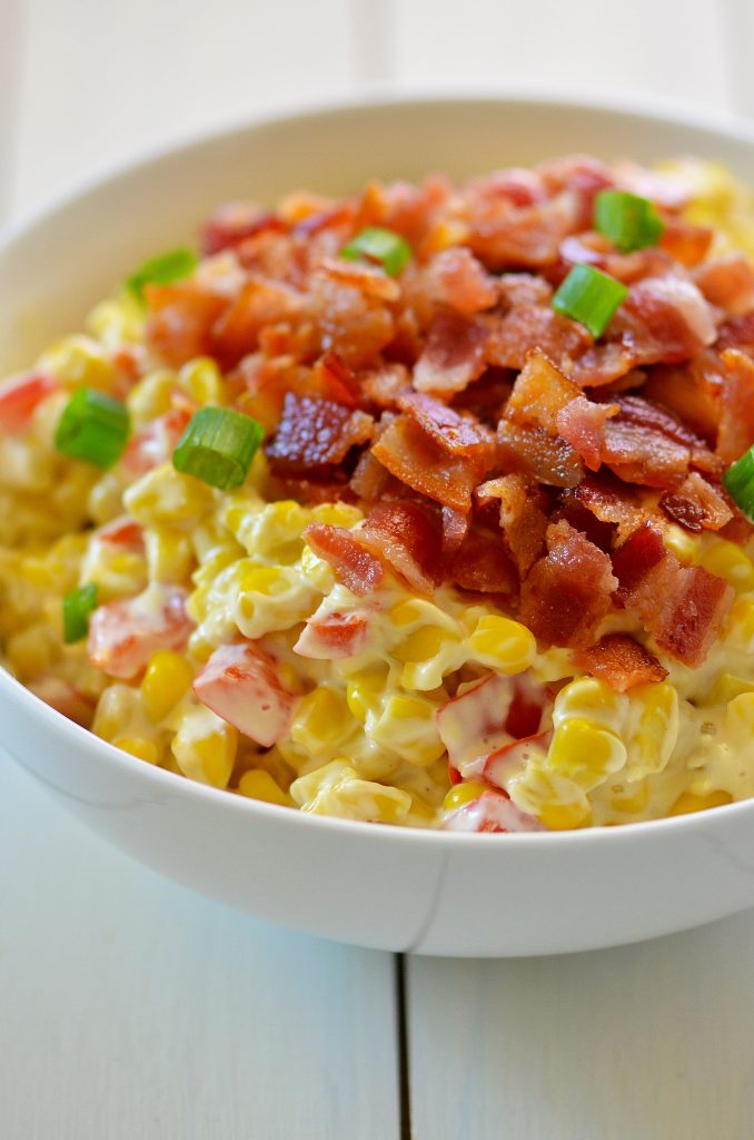 Confetti corn is colorful creamy corn with bacon and cream cheese. Life-in-the-Lofthouse.com