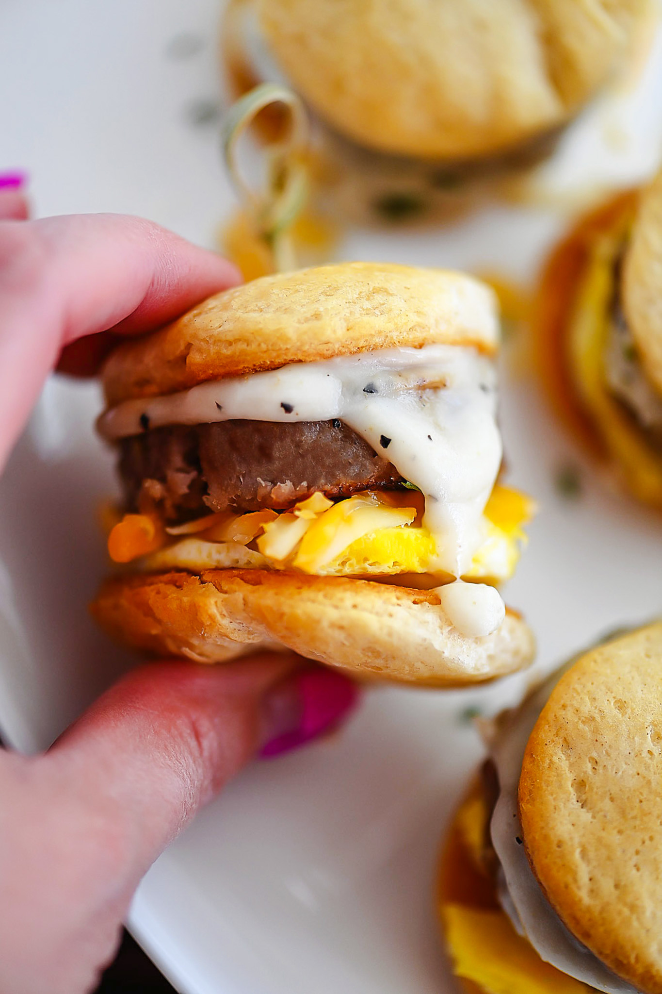 Little savory breakfast sandwiches that will brighten up any morning.  These little sliders are layered with flavor and packed with your morning protein.