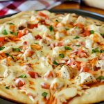 Creamy mild enchilada sauce, grilled chicken, loads of mozzarella cheese and diced tomato and cilantro make up this delicious chicken enchilada pizza. Life-in-the-Lofthouse.com