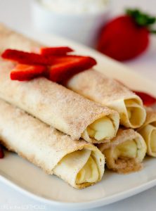 Cheesecake Taquitos have a silky-smooth cheesecake filling wrapped inside a crispy flour tortilla that's been rolled in cinnamon and sugar. Life-in-the-Lofthouse.com