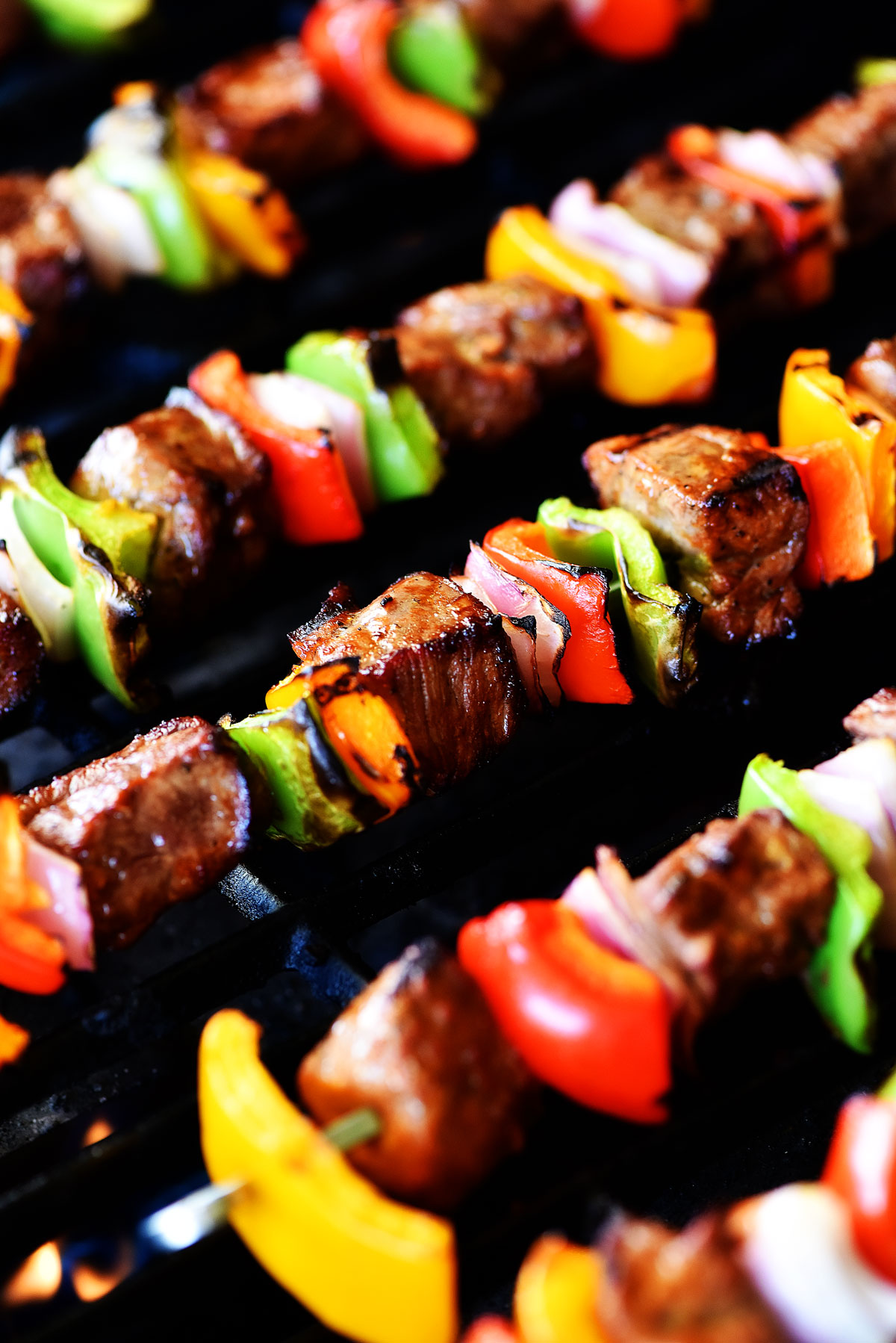 Grilled Steak Kebabs are made of delicious marinated steak pieces with bell peppers and red onion. Life-in-the-Lofthouse.com