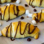 Flaky, buttery crescent rolls stuffed with Nutella, marshmallows, chocolate chips and graham cracker. Life-in-the-Lofthouse.com