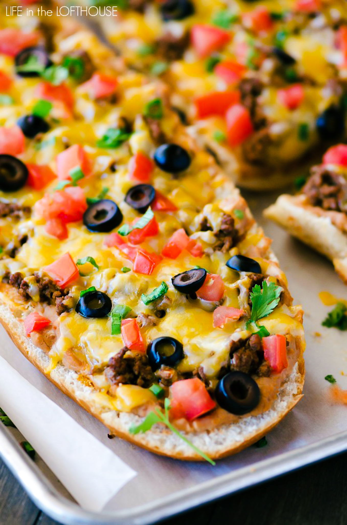 Taco French bread pizza has all the flavors of a taco transformed into a pizza using french bread. Life-in-the-Lofthouse.com