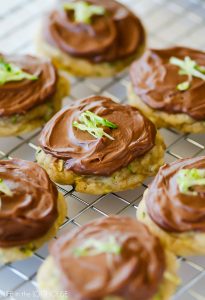 Soft zucchini cookies topped with a creamy chocolate cream cheese frosting. Life-in-the-Lofthouse.com