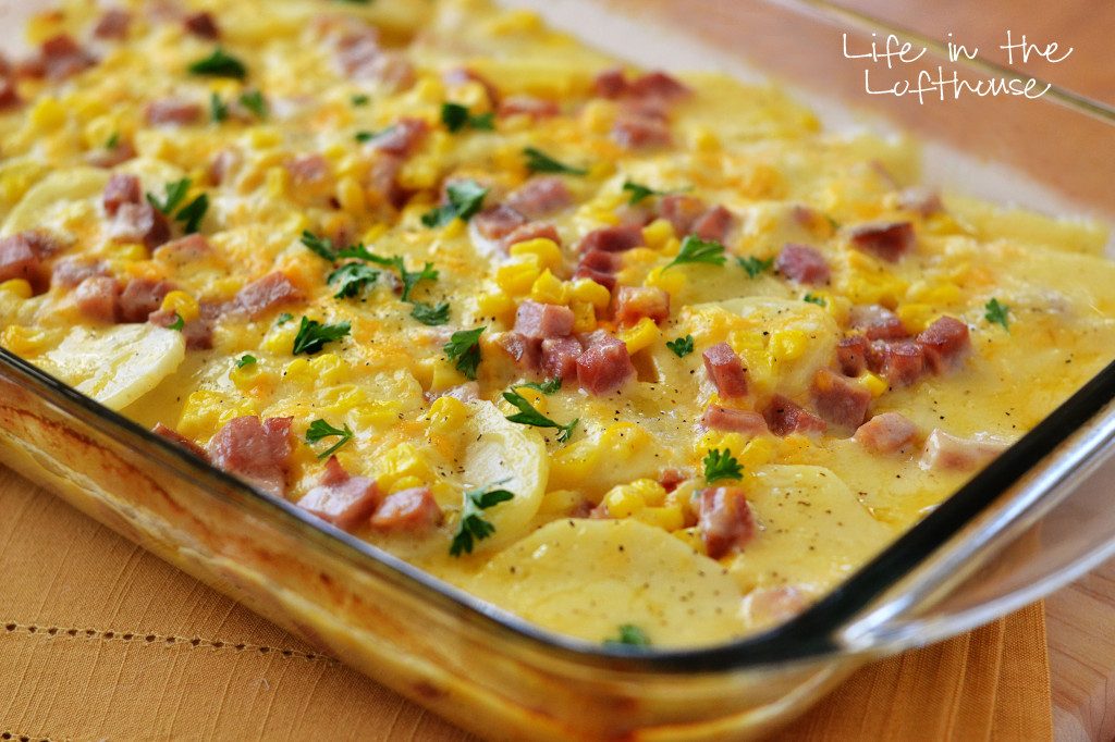 Delicious cheesy and buttery scalloped potatoes covered in ham and corn. Life-in-the-Lofthouse.com