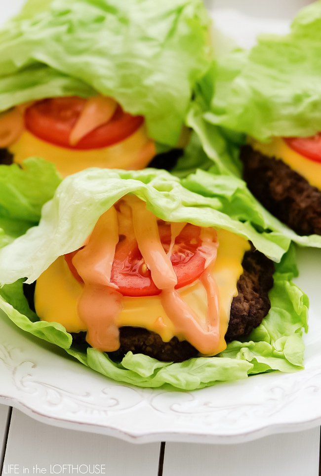 A flavorful burger topped with cheese, tomato, and a mouth-watering spread wrapped in lettuce. Life-in-the-Lofthouse.com