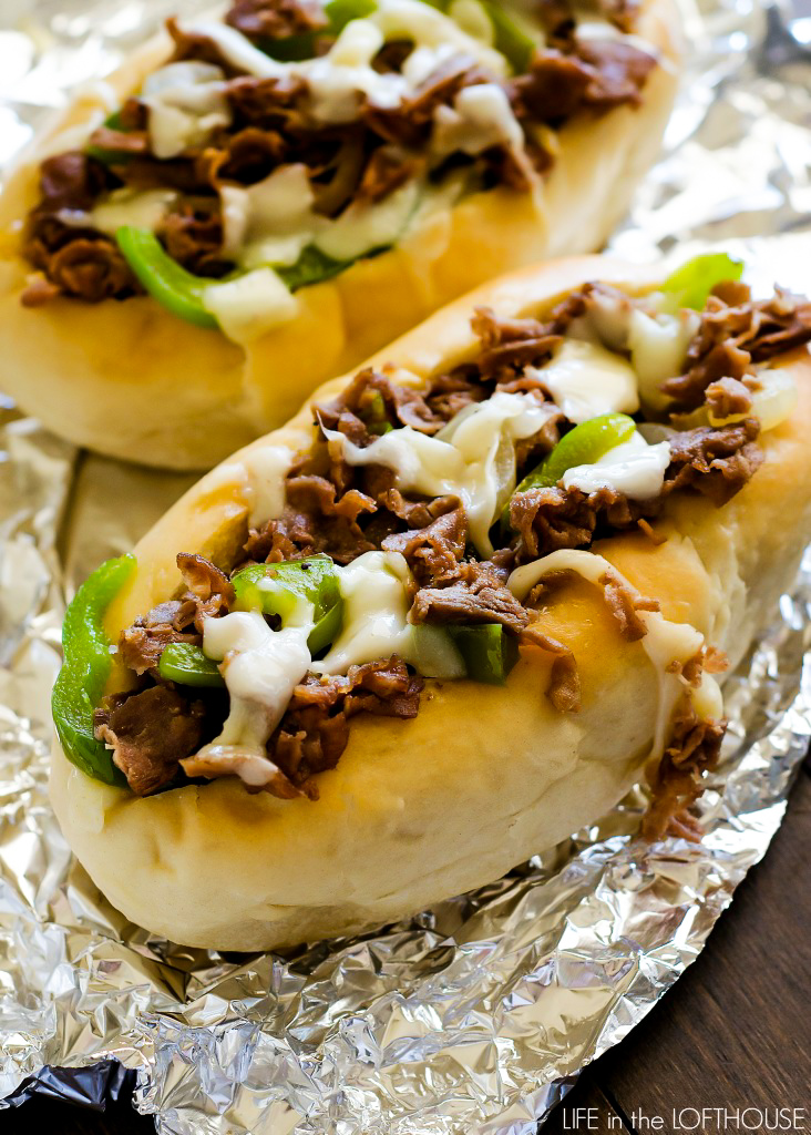 Cheesesteak sandwiches are hearty, flavorful sandwiches full of sliced steak, green pepper, onion and Provolone cheese. Life-in-the-Lofthouse.com