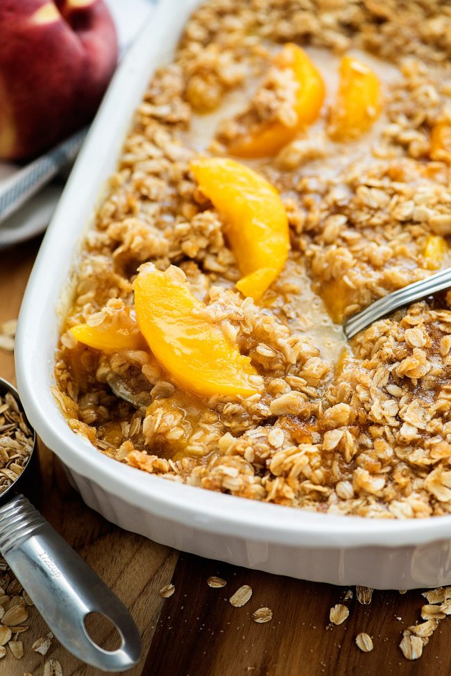 Peach Crisp starts with a bottom layer of flaky, buttery pastry and sweet peach filling and is then covered in a crumbly oatmeal streusel topping. Life-in-the-Lofthouse.com