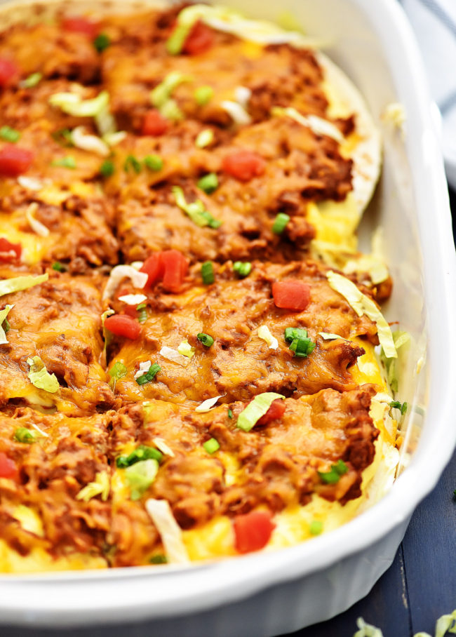 Baked burrito casserole has layers of flour tortillas, beans, meat and cheese. Life-in-the-Lofthouse.com