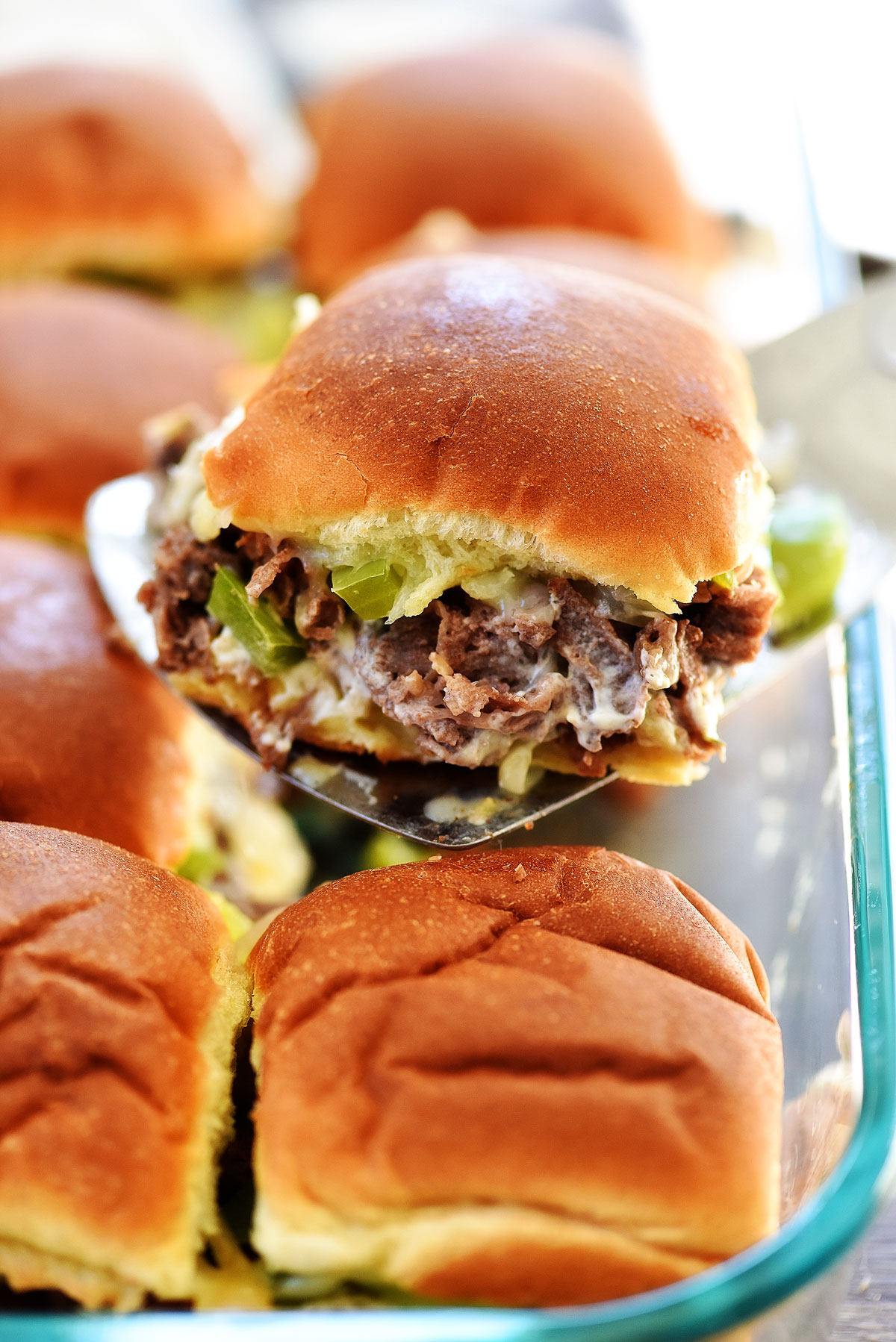 Cheesesteak Sliders are filled with warm pieces of steak, gooey cheese, peppers and onion. Life-in-the-Lofthouse.com