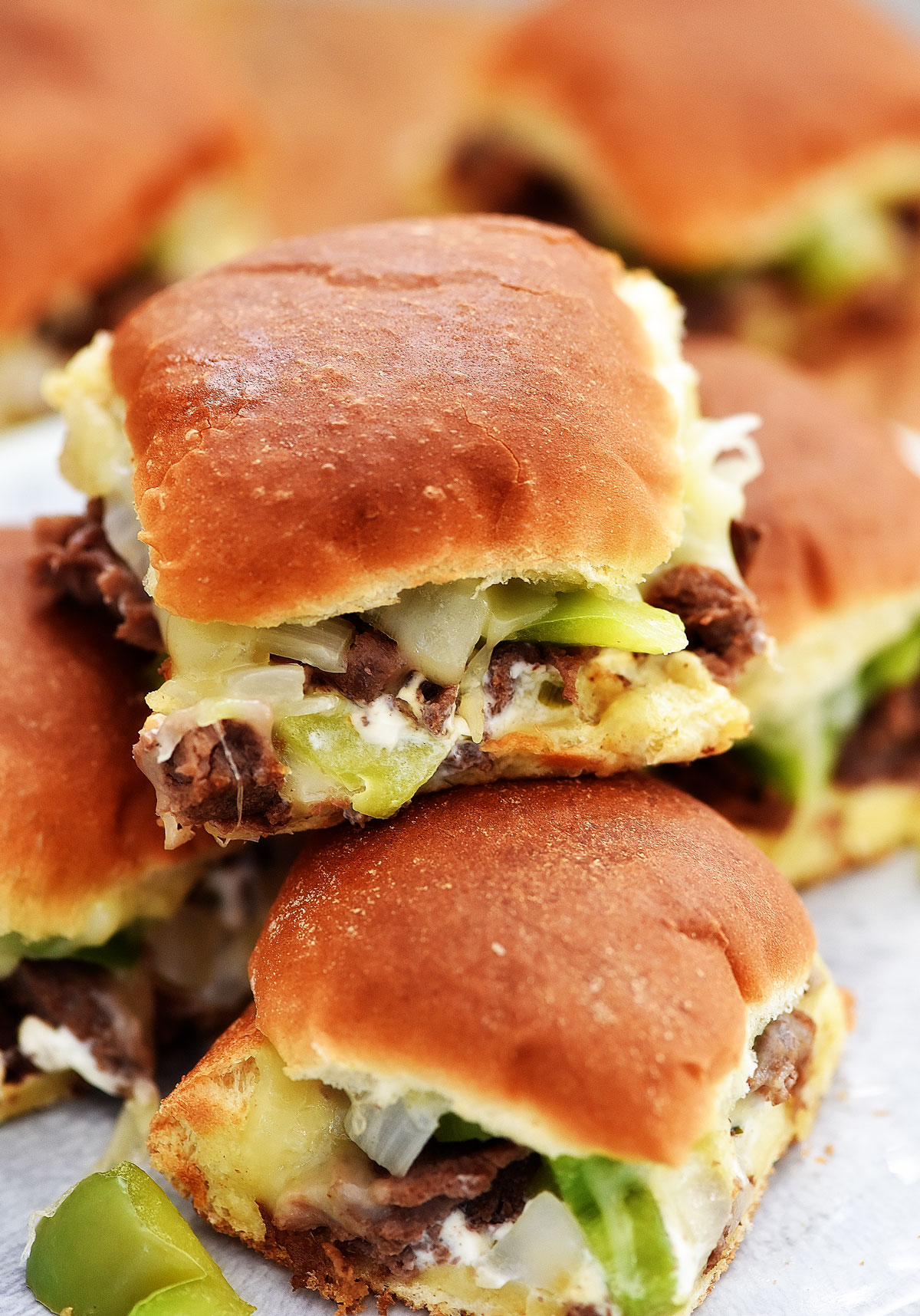 Cheesesteak Sliders are filled with warm pieces of steak, gooey cheese, peppers and onion. Life-in-the-Lofthouse.com