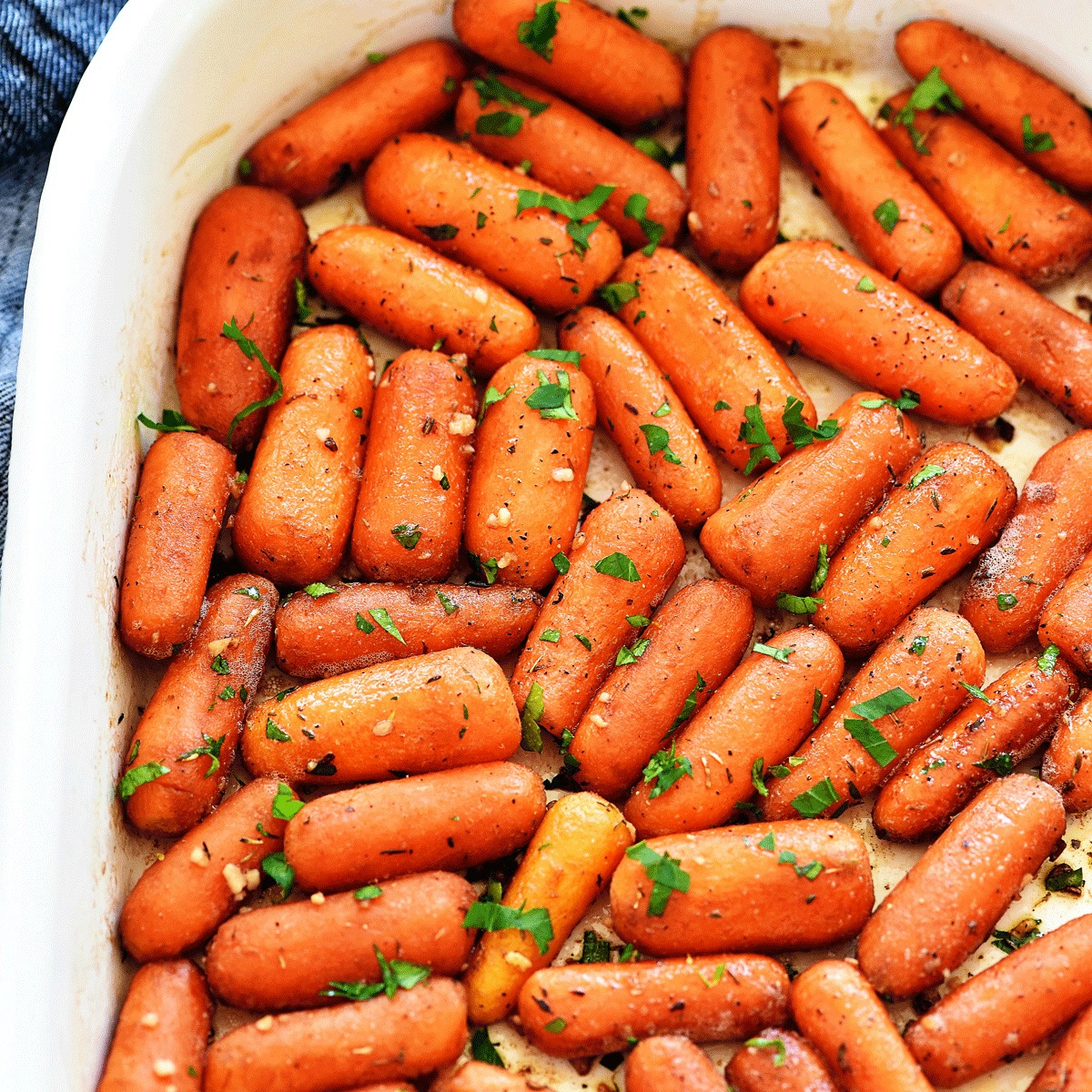 Delicious oven-baked Garlic Roasted Carrots that are loaded with flavor. Life-in-the-Lofthouse.com
