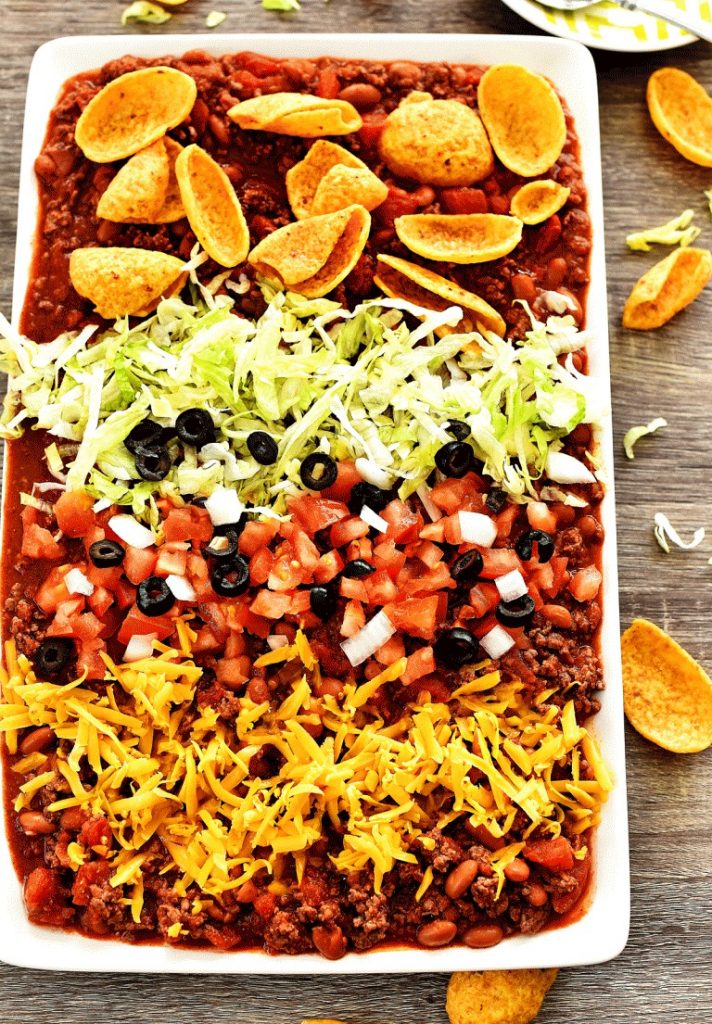 Texas Taco Dip is filled with beans, beef chili and loads of cheese. Life-in-the-Lofthouse.com