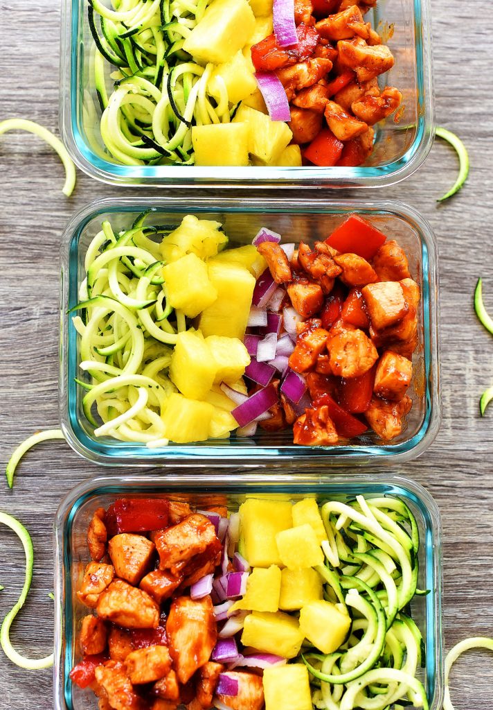 Hawaiian Chicken meal prep bowls are filled with seasoned barbecue chicken, bell pepper, fresh pineapple, red onion and zucchini noodles. Life-in-the-Lofthouse.com