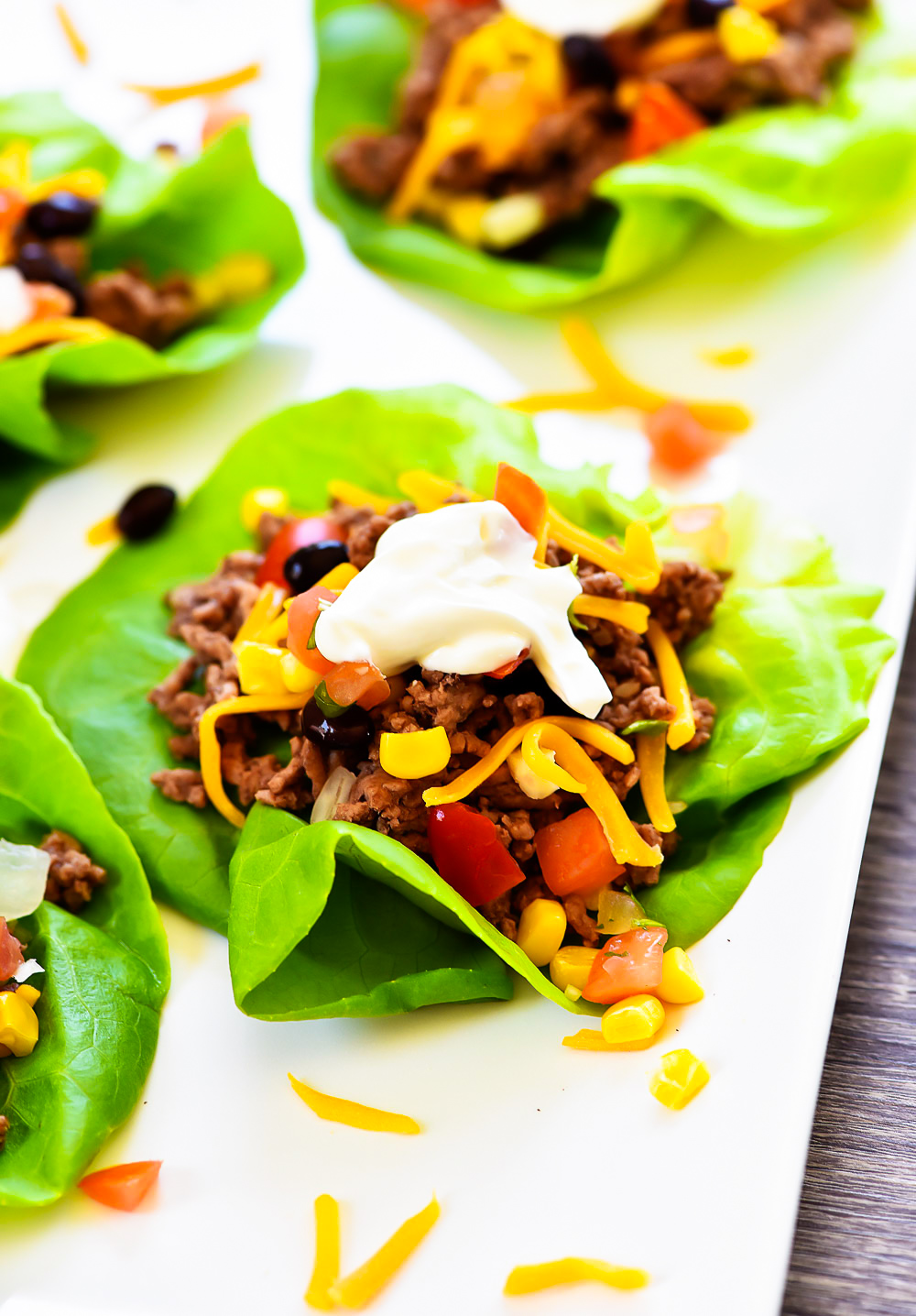 Taco Lettuce Wraps are filled with seasoned ground beef, corn, black beans, cheese and taco sauce. Life-in-the-Lofthouse.com