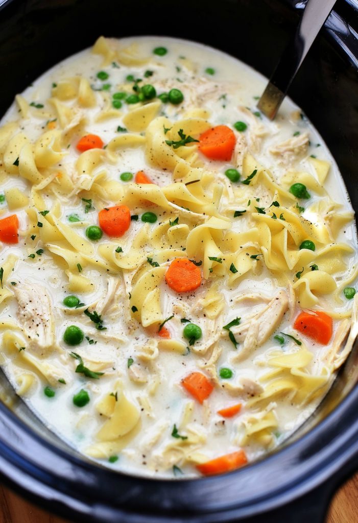 Chicken Noodle Soup is a creamy soup full of carrots, peas, chicken and noodles and all cooked in the Slow Cooker. Life-in-the-Lofthouse.com