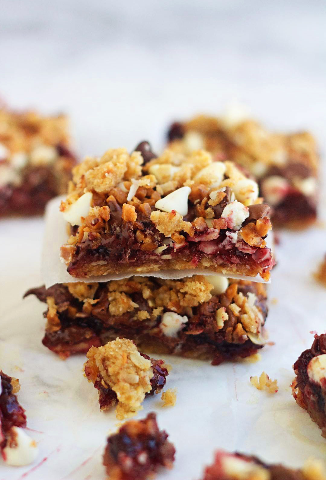 Blackberry Bliss Bars have a brown sugar cookie base with coconut and oats and are topped with a layer of blackberry jam, three kinds of chocolate chips and toffee pieces. Life-in-the-Lofthouse.com