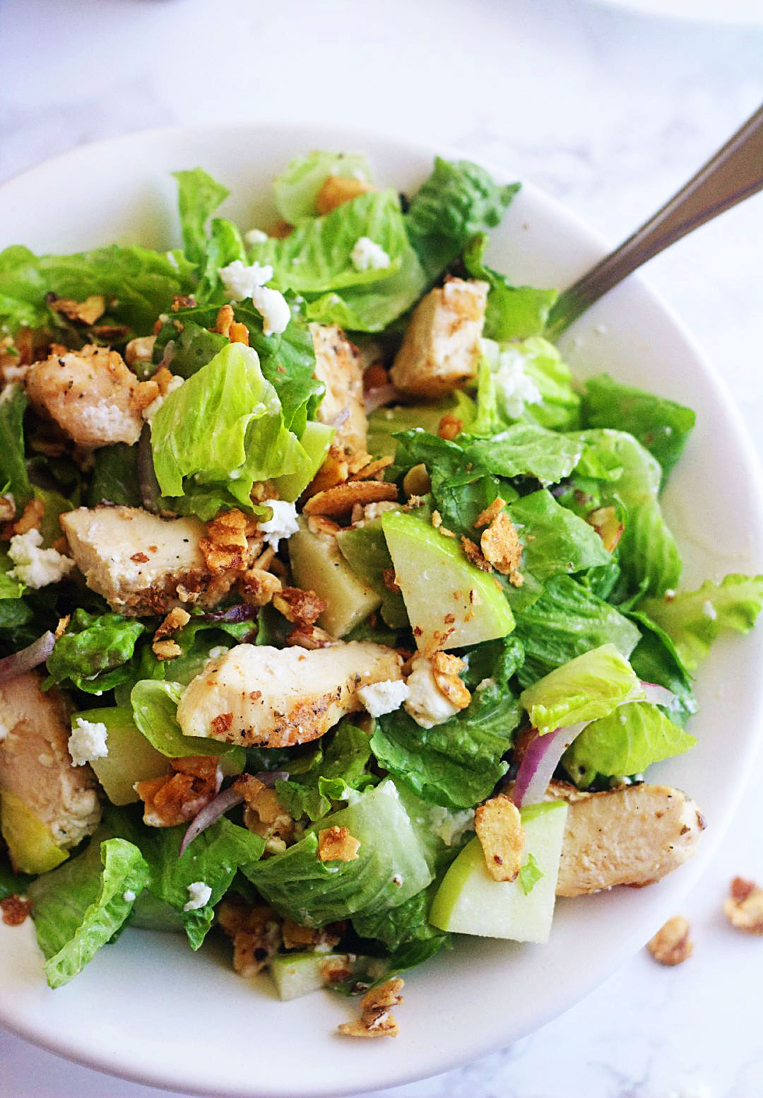 Chicken, Apple & Goat Cheese Salad is full of candied nuts, apples, goat cheese & chicken and tossed in a light champagne vinaigrette. Life-in-the-Lofthouse.com