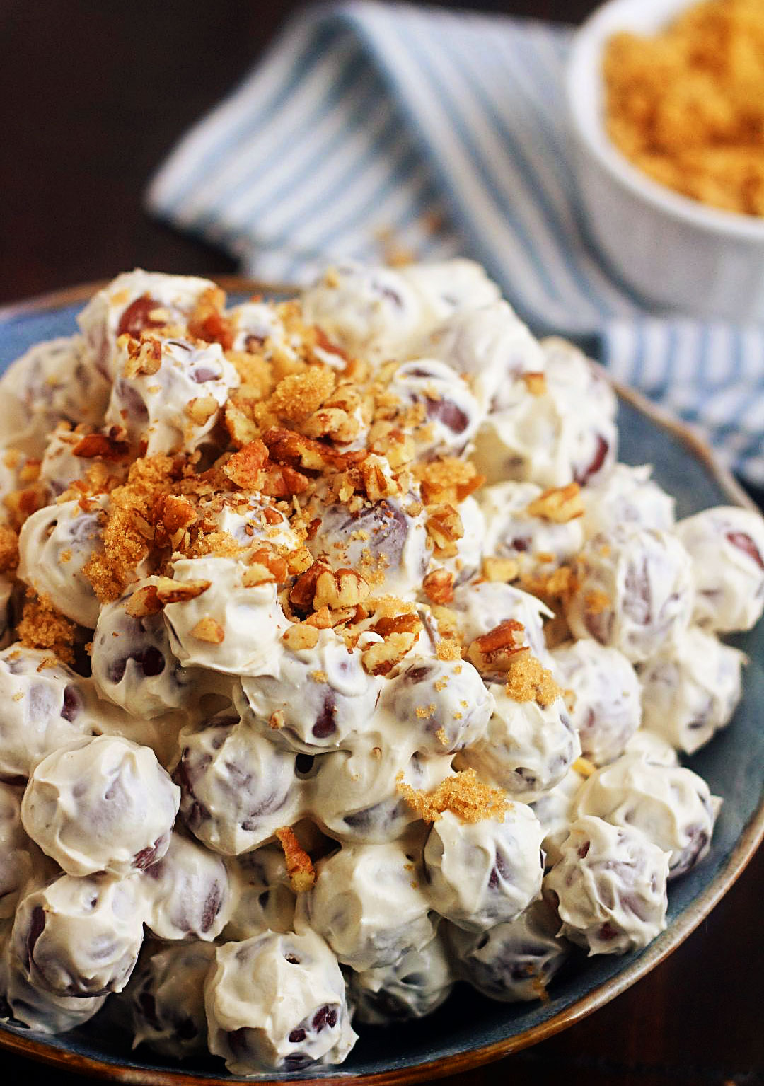 Grape Salad is full of fresh, sweet grapes, tossed in a sweet cream cheese dressing, then sprinkled with brown sugar and pecans. Life-in-the-Lofthouse.com