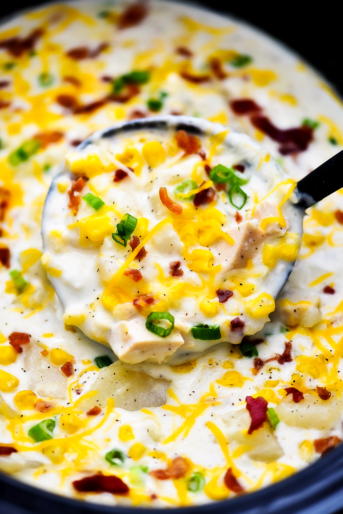 Crock Pot Chicken Corn Chowder is a thick, creamy chowder filled with tender chicken, potatoes, corn, bacon and cheese. Life-in-the-Lofthouse.com