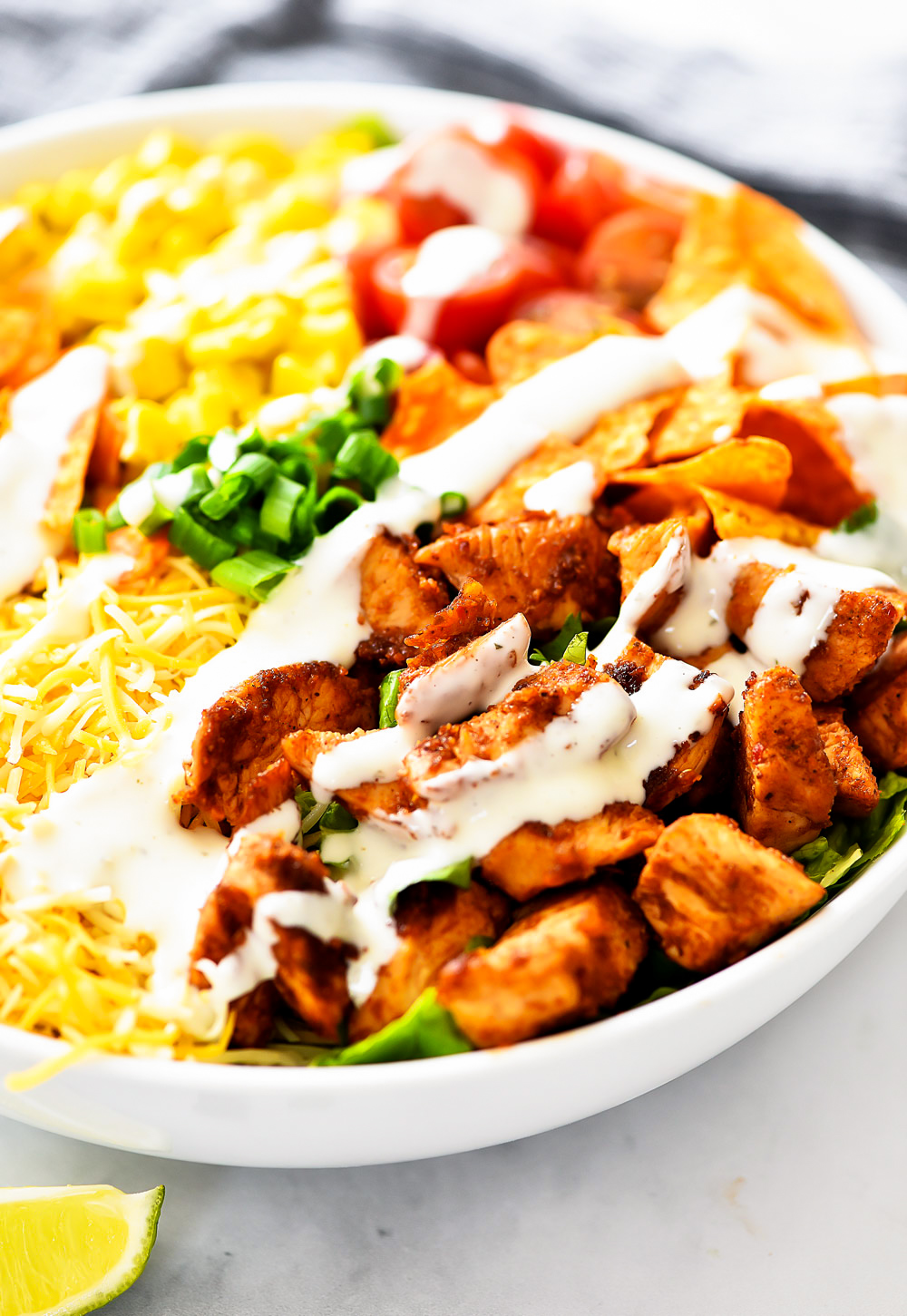 Doritos Chicken Taco Salad is filled with seasoned grilled chicken, corn, tomatoes, cheese and nacho cheese Doritos. Life-in-the-Lofthouse.com