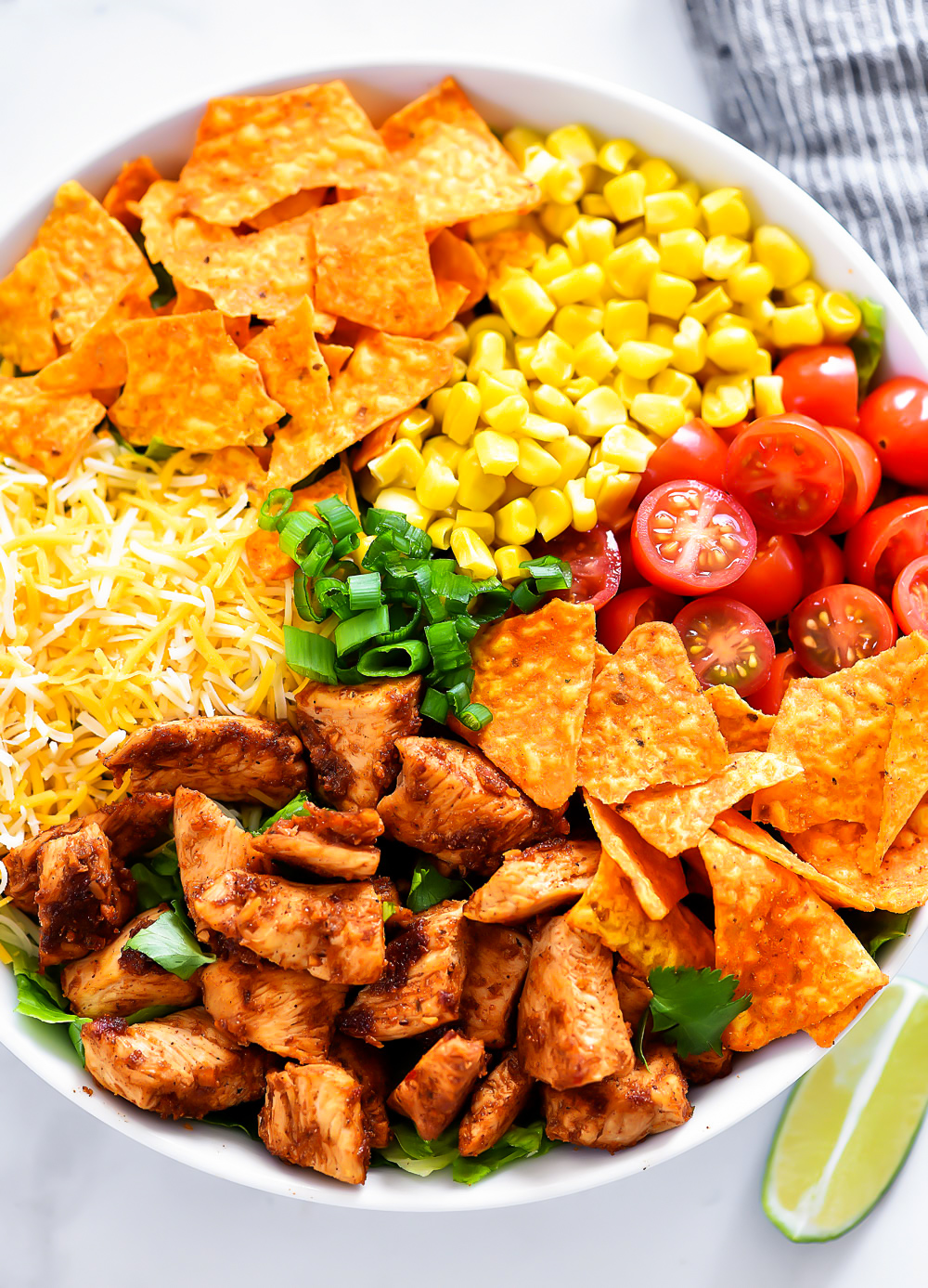 Doritos Chicken Taco Salad is filled with seasoned grilled chicken, corn, tomatoes, cheese and nacho cheese Doritos. Life-in-the-Lofthouse.com