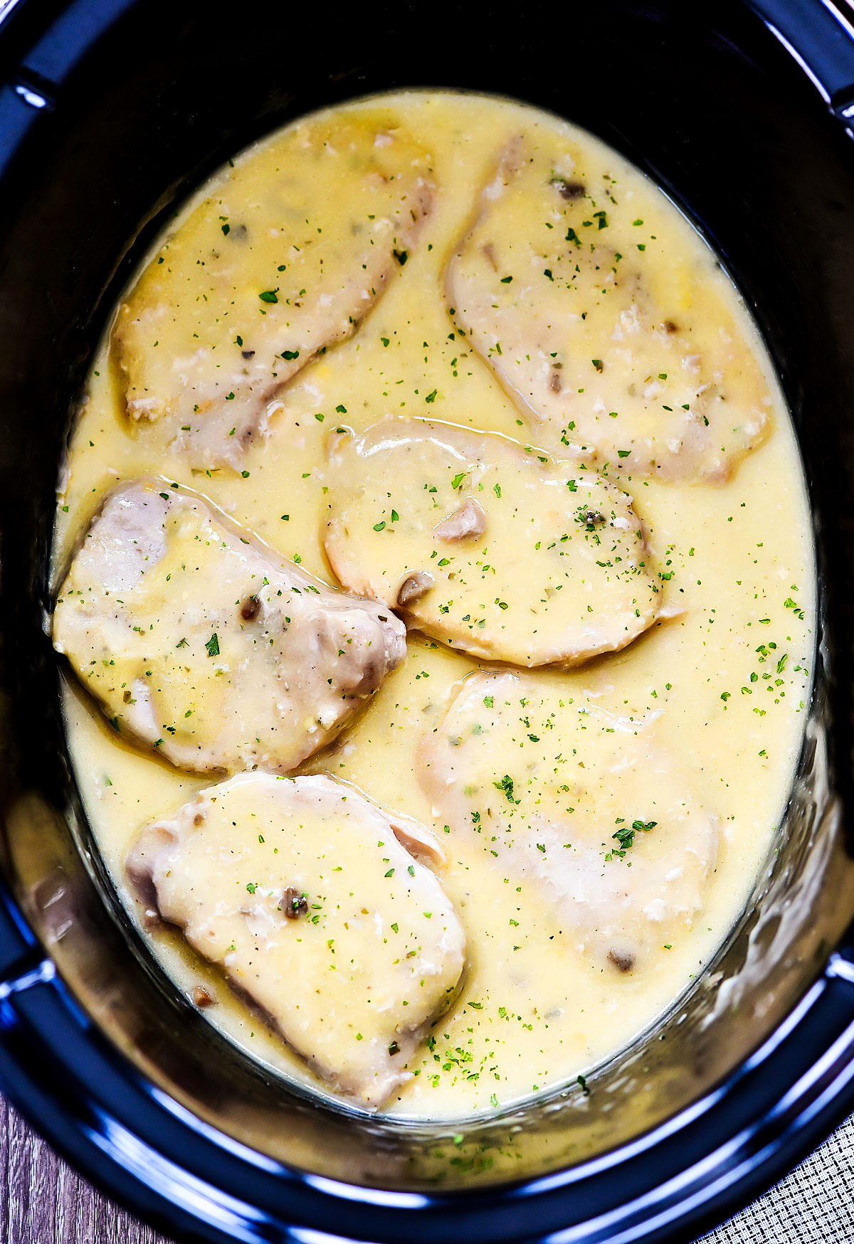 Creamy Ranch Pork chops are slow cooked with chicken and mushroom soups and ranch seasoning. Life-in-the-Lofthouse.com