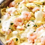 Shrimp Tortellini Alfredo has rich and creamy homemade Alfredo sauce poured over golden shrimp and cheese-filled tortellini. Life-in-the-Lofthouse.com