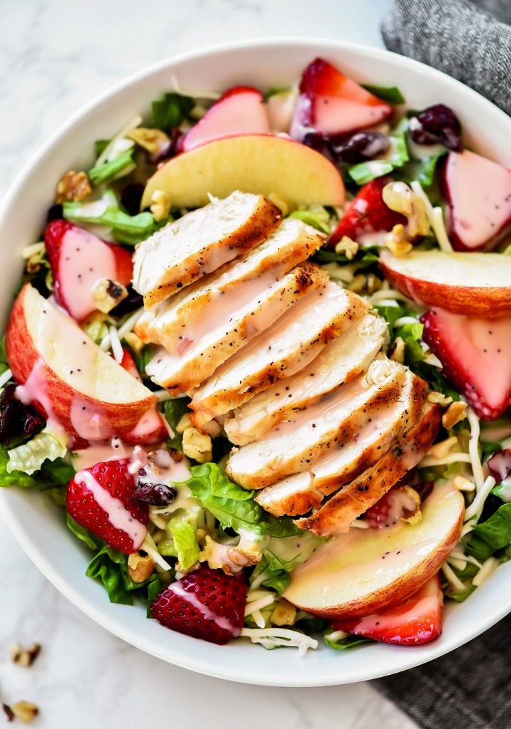 The Best Strawberry Chicken Salad is a refreshing salad full of grilled chicken, strawberries, sliced apples, mozzarella cheese and more. Life-in-the-Lofthouse.com