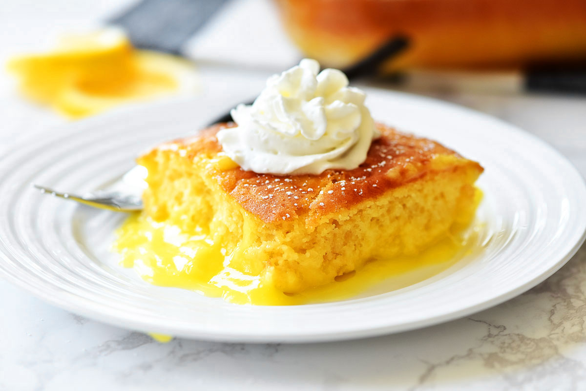 Lemon Pudding Cake is a moist, light and fluffy yellow cake that bakes over the top of creamy lemon pudding. Life-in-the-Lofthouse.com