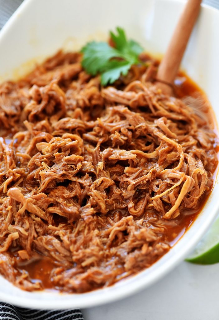 Slow Cooker Sweet Pork is delicious sweet pork given its flavor from brown sugar, red enchilada sauce and diced green chilies. Life-in-the-Lofthouse.com