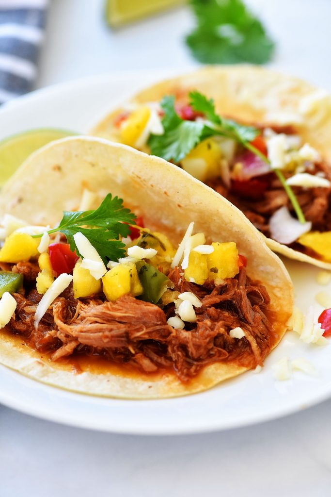 Sweet Pork tacos are tacos filled with tender sweet pork, Monterey jack cheese and pineapple salsa. Life-in-the-Lofthouse.com