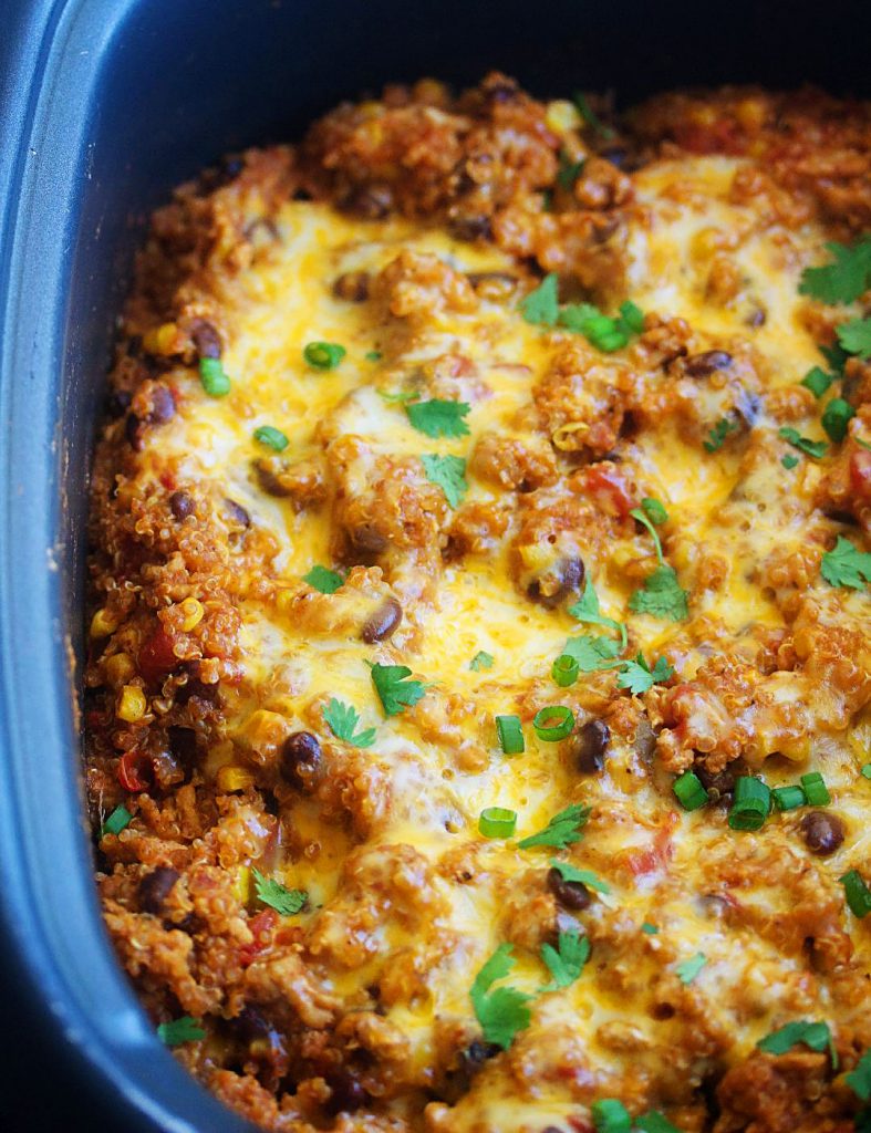 Slow Cooker Chicken Enchilada Quinoa is loaded with quinoa, veggies, ground chicken and topped with lots of cheese. Life-in-the-Lofthouse.com